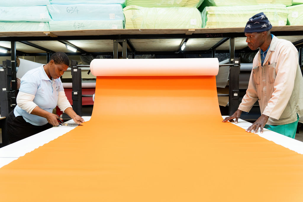 Sonpra Superstore staff members cutting vinyl for customers